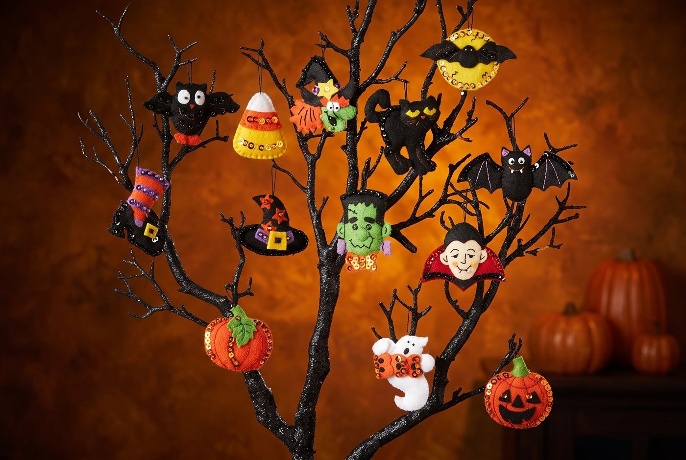 Bucilla Halloween felt ornament kit set of 12 (86430) Halloween 86430 felt applique Halloween ornament set of 12 on bare branch tree