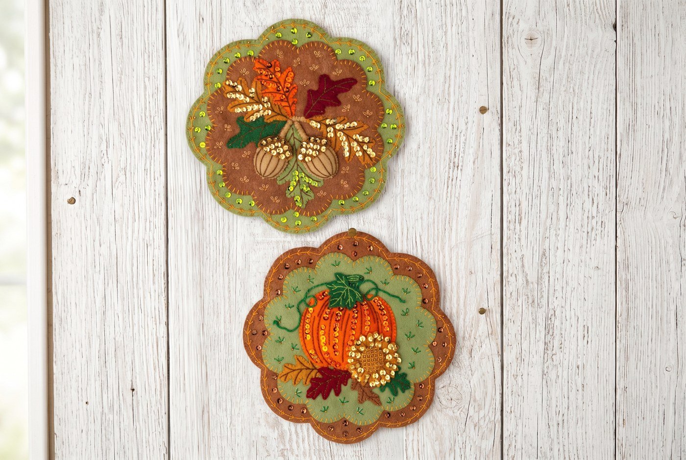 Bucilla Pumpkin Patch Pair felt-applique wall hanging kit (89712E) Pumpkin Patch Wall Hanging 89712E felt applique pair — scallop-edged acorn and pumpkin wall hangings on white wood