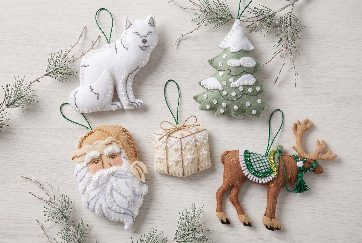 Bucilla Nordic Noel Scandinavian felt ornament kit set of 4 (89754E) Nordic Noel 89754E felt applique ornament set of 4 — fox, tree, Santa and reindeer